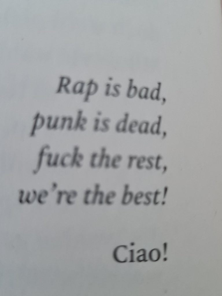 blurred photo of book quote:
Rap is bad,
punk is dead,
fuck the rest,
we're the best!
Ciao!