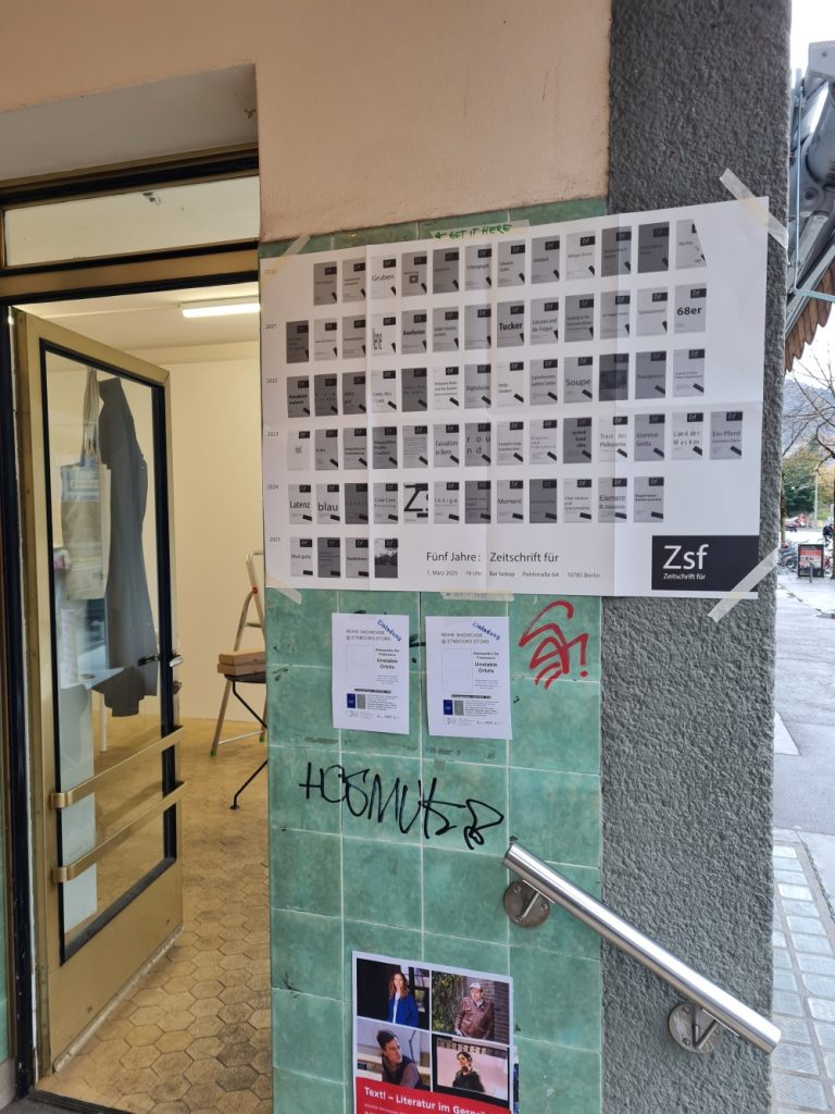 happy birthday, zsf! zsf veranstaltungsposter mit allen covern vor etkbooks kunstraumeingang. randbeschriftung: GET IT HERE.